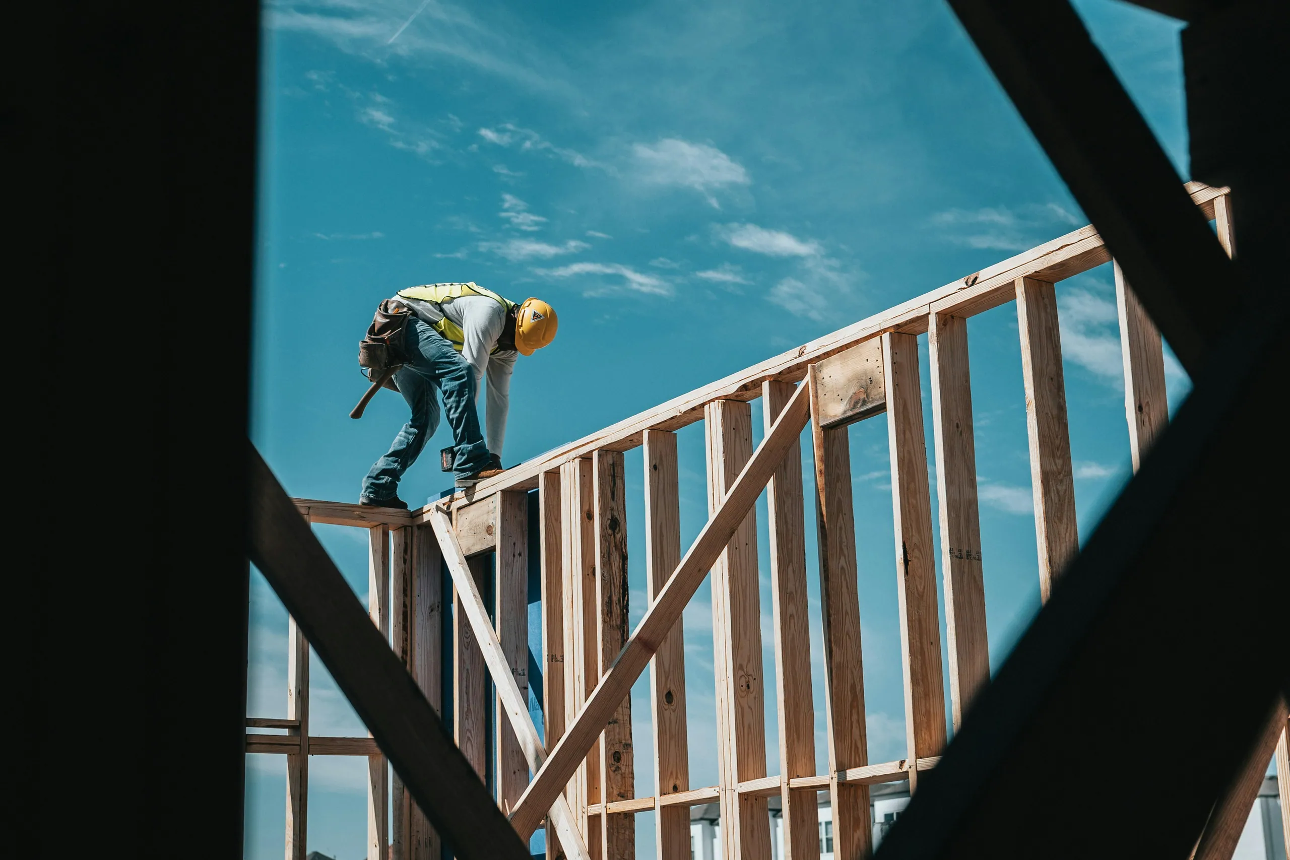 A framer working on the structure of a new custom home