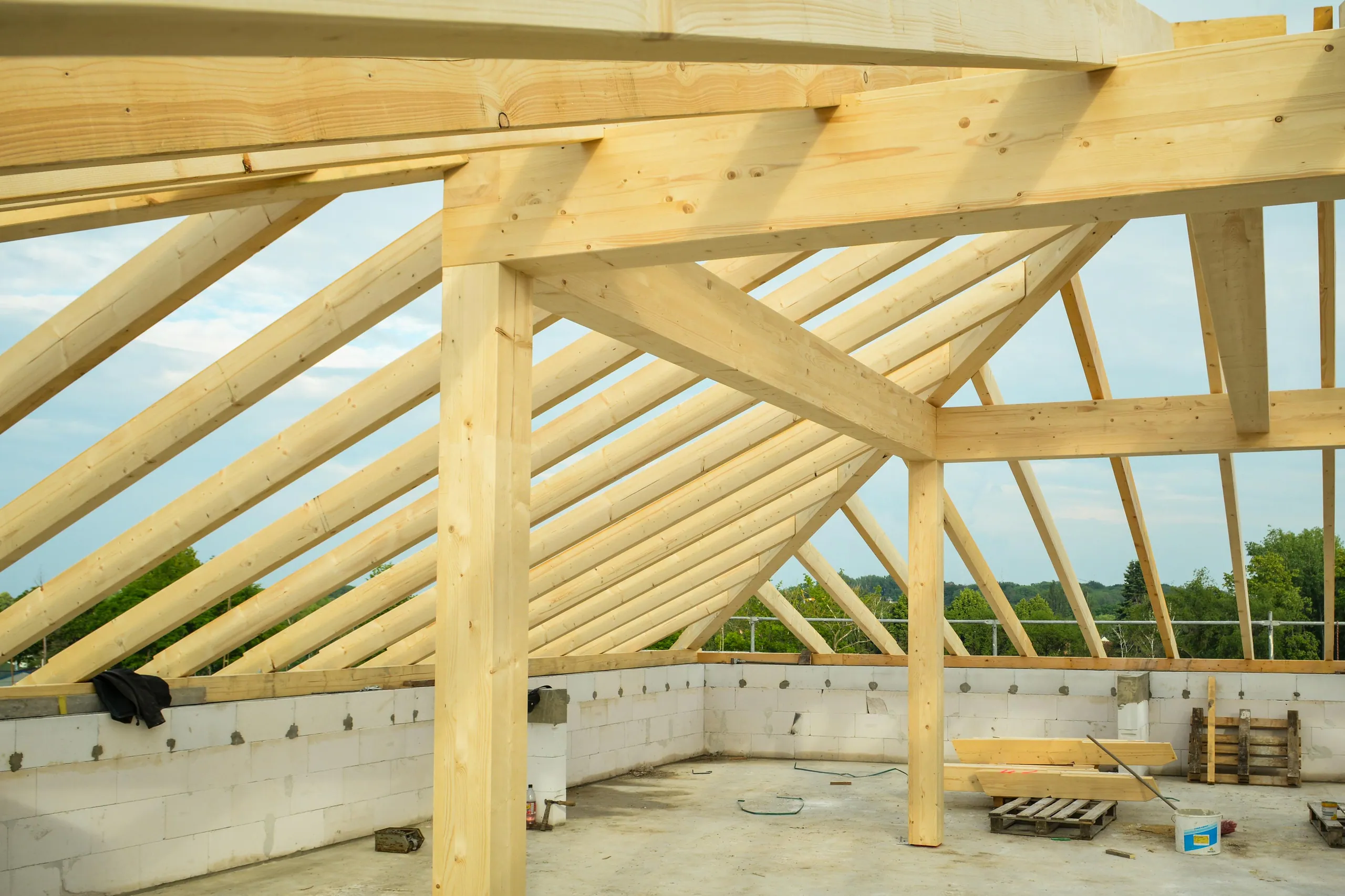 Newly framed timber roof trusses on a custom home under construction